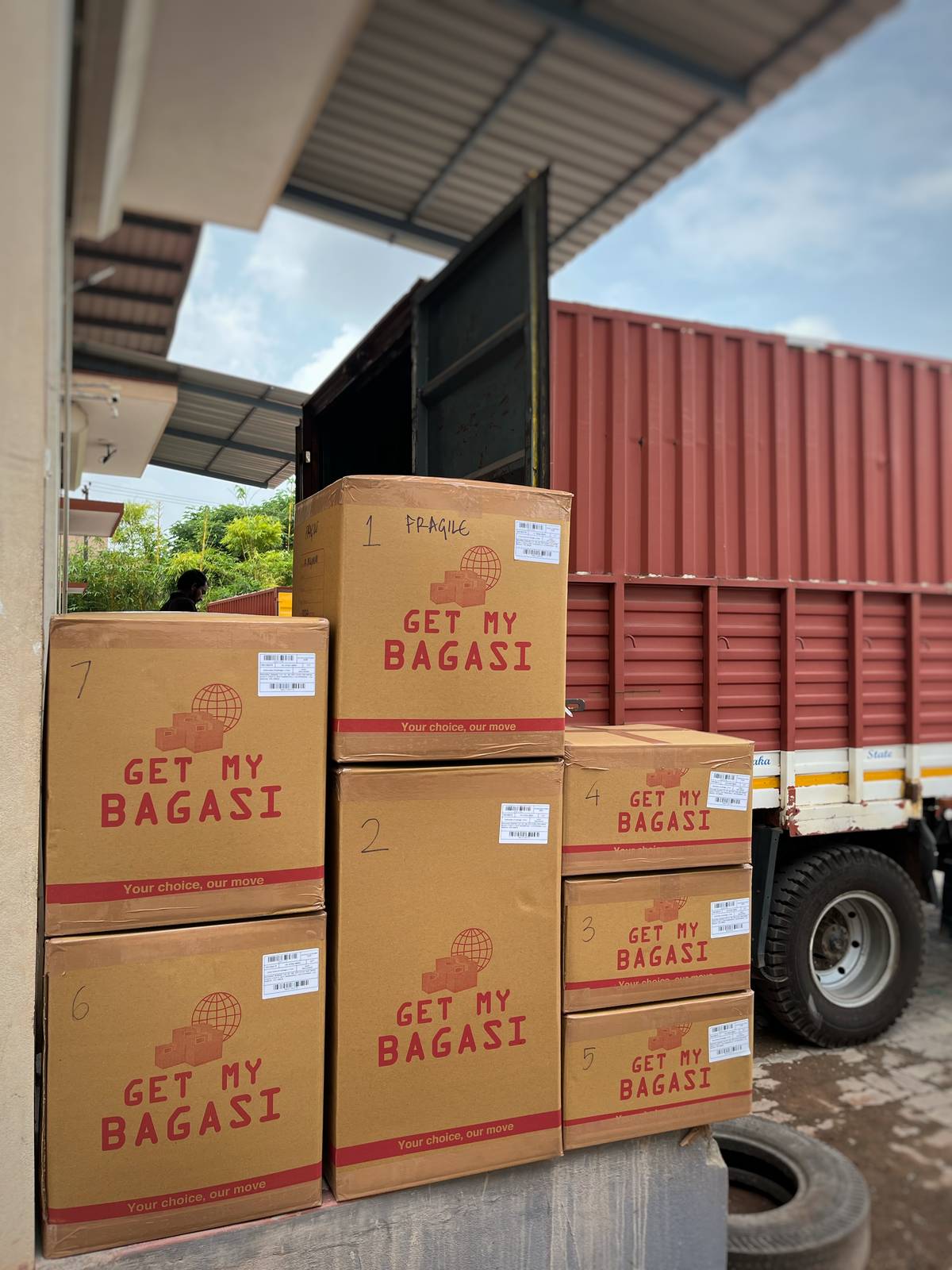 Branded Get My Bagasi student-baggage cartons loaded for shipment